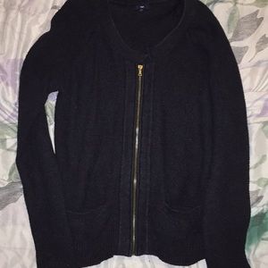 A navy blue zip-up sweater